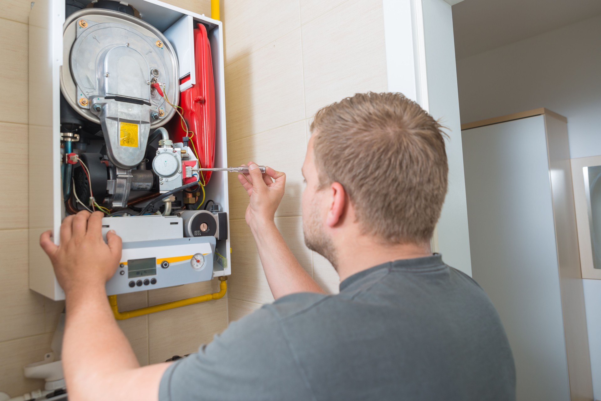 Technician repairing Gas Furnace